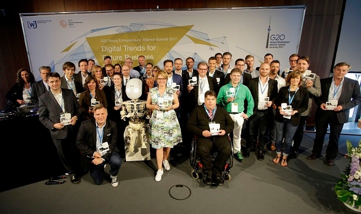 A WE DO DIGITAL Group picture of all 36 winners on stage at the G2ß Young Entrepreneur Summit.